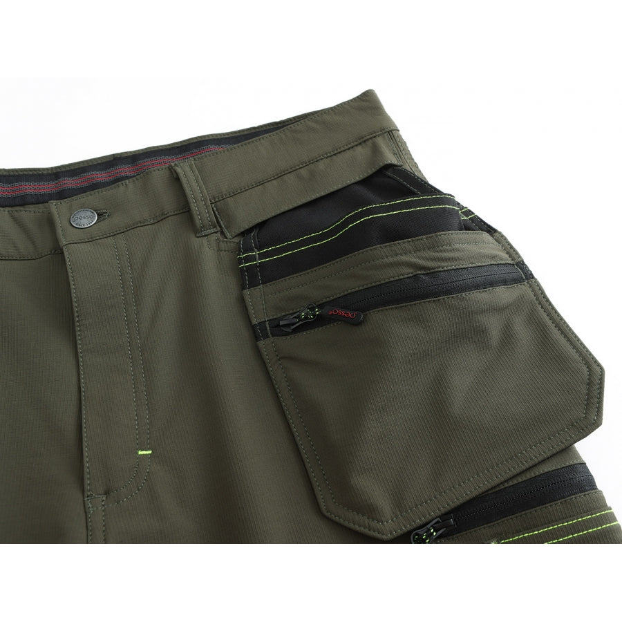 Funkcionalios kišenės: 4 priekinės kišenės, nugaroje dvi praplatintos kišenės, klešnių šoninės kišenės. Kišenė ruletei, plaktukui, mobiliam telefonui.  Antkeliai: Kelių srityje prisiūtos specialiai išformuotos kišenės įkišamiems antkeliams, išoriškai dviejuose aukščiuose sutvirtintos Cordura® audinio antsiuvais. 4-Way Stretch tamprus audinys nugaros dalyje. Atšvaitinės detalės kelnių klešnių apačioje.