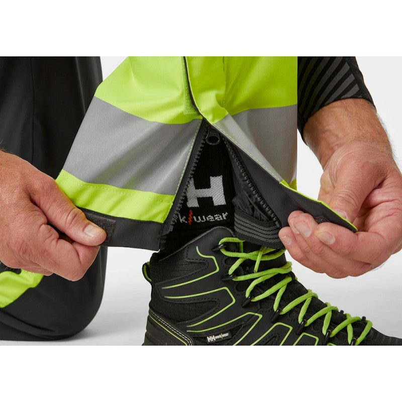 Žieminės šviesą atspindinčios kelnės Helly Hansen Alna 2.0 WINTER PANTS CL 1, juodos/geltonos