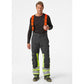 Žieminės šviesą atspindinčios kelnės Helly Hansen Alna 2.0 WINTER PANTS CL 1, juodos/geltonos